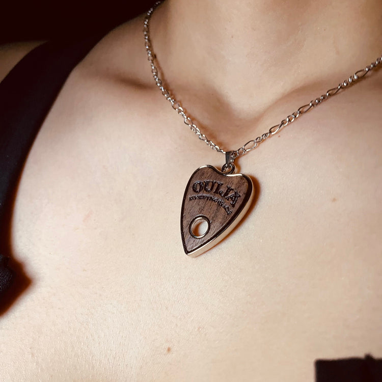 Shop Wooden Ouija - Necklace from Forbidden Alchemy’s collection. Crafted from premium alloy zinc, each piece showcases detailed. Tagged: Necklaces.Necklacesforbidden alchemyNecklaces