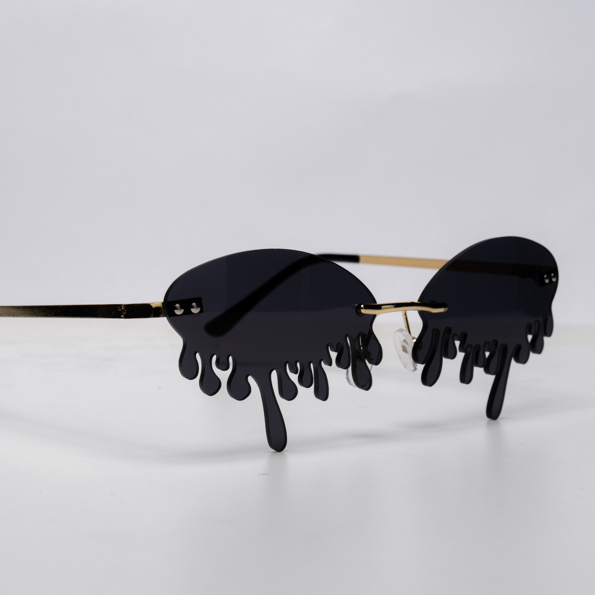 Shop Drip Shades from Forbidden Alchemy's gothic sunglasses. Premium quality eyewear featuring bold frames and authentic goth aesthetics. Tagged: shades.Sunglassesforbidden alchemyshades