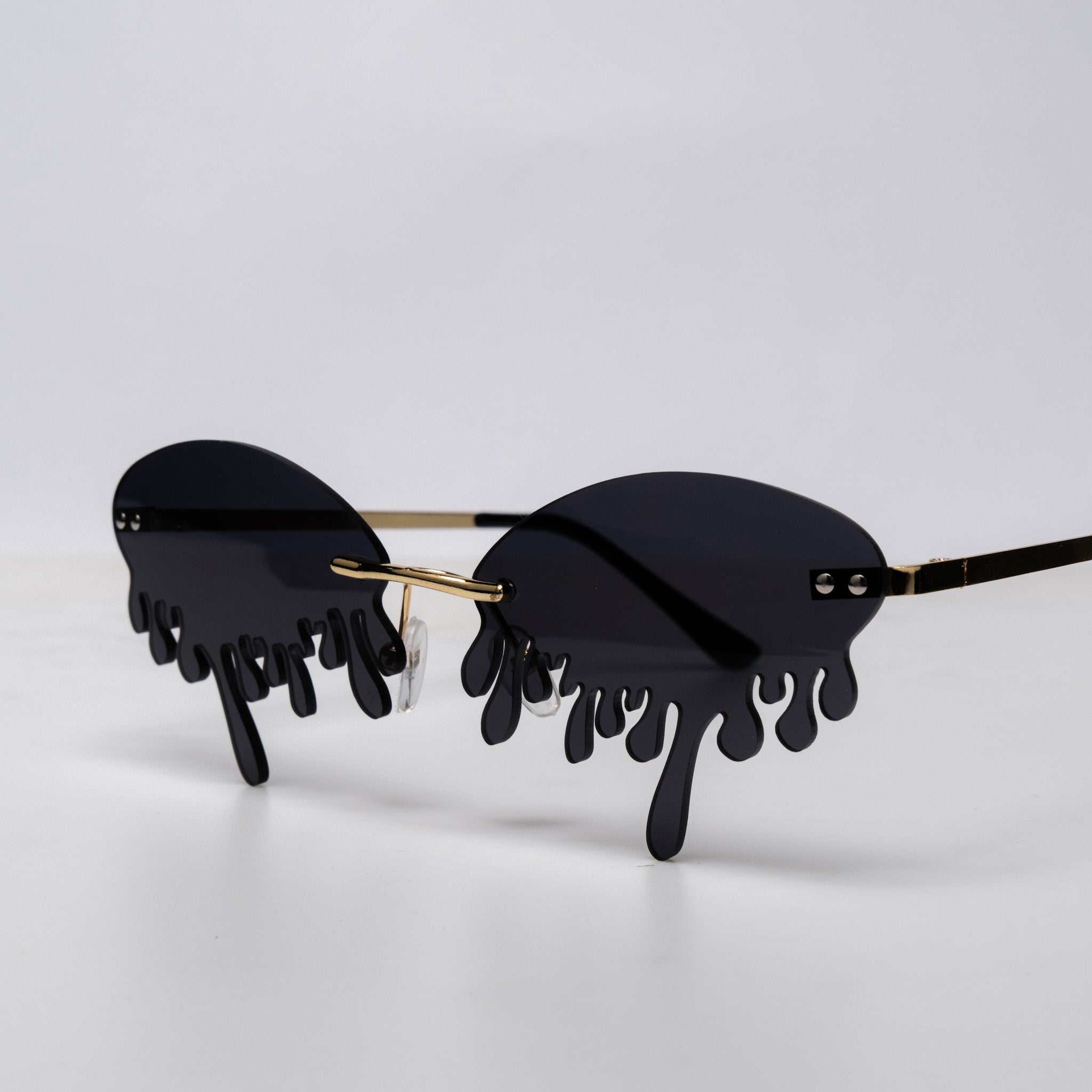 Shop Drip Shades from Forbidden Alchemy's gothic sunglasses. Premium quality eyewear featuring bold frames and authentic goth aesthetics. Tagged: shades.Sunglassesforbidden alchemyshades