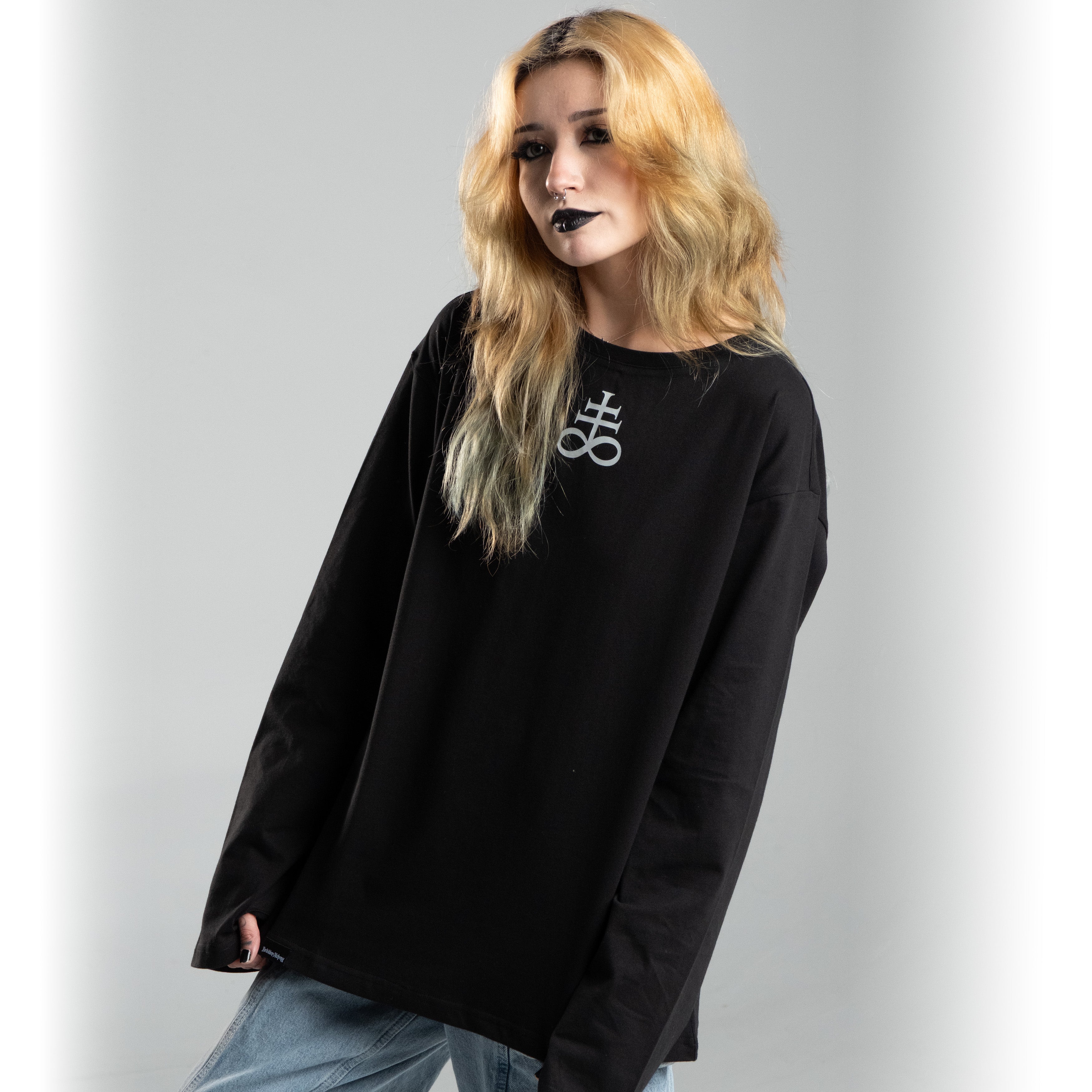 Model wearing Nocturne Sigil long sleeve shirt featuring dark, detailed design in black cotton, ideal for a bold fashion statement.