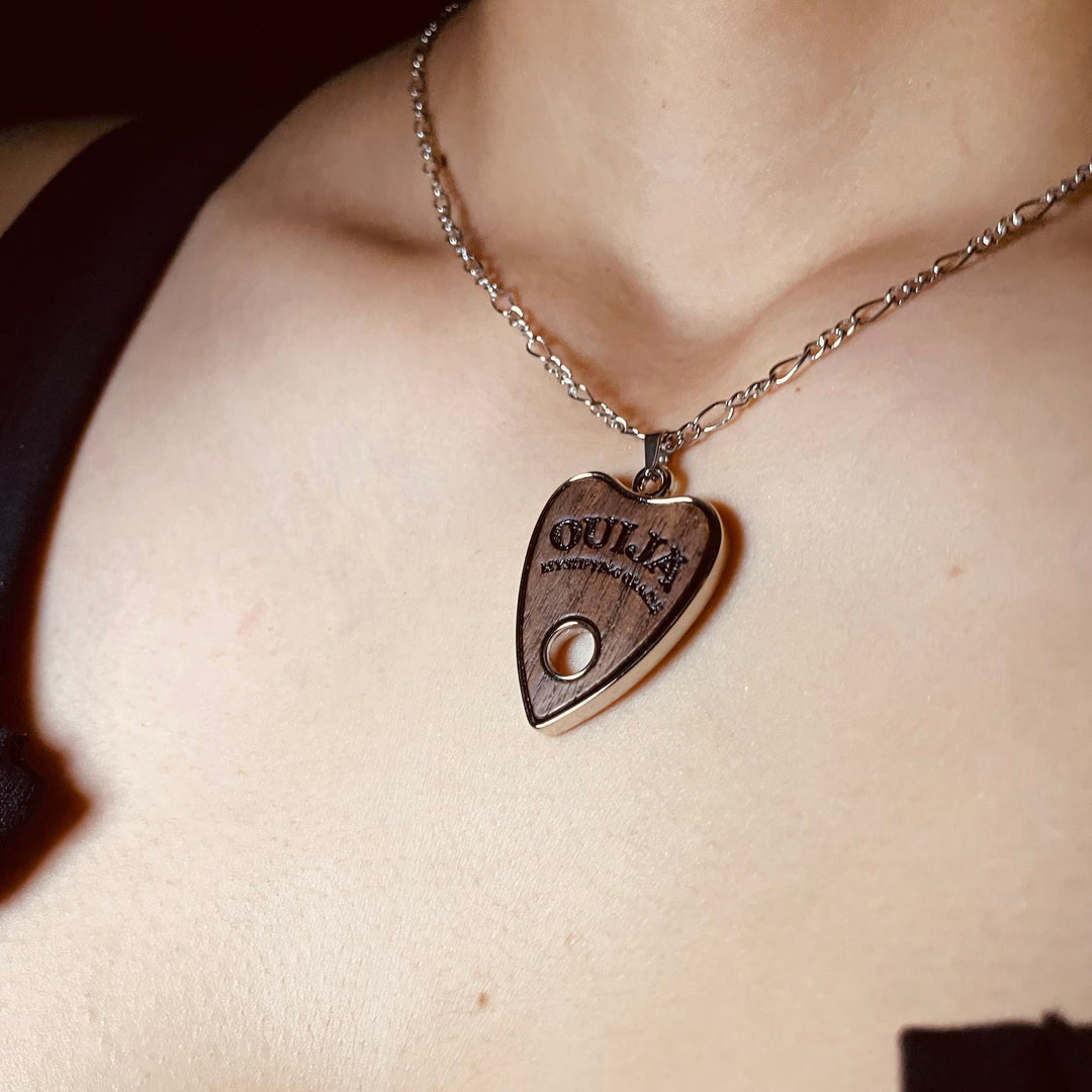 Shop Wooden Ouija - Necklace from Forbidden Alchemy’s collection. Crafted from premium alloy zinc, each piece showcases detailed. Tagged: Necklaces.Necklacesforbidden alchemyNecklaces